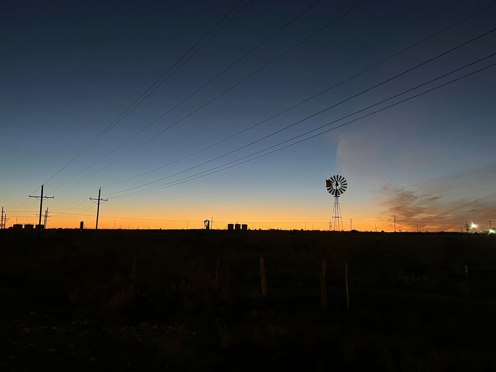 West Texas land and energy infrastructure at dusk